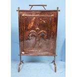 An Arts & Crafts copper firescreen together with a heavy copper coal bucket and pair of brass-