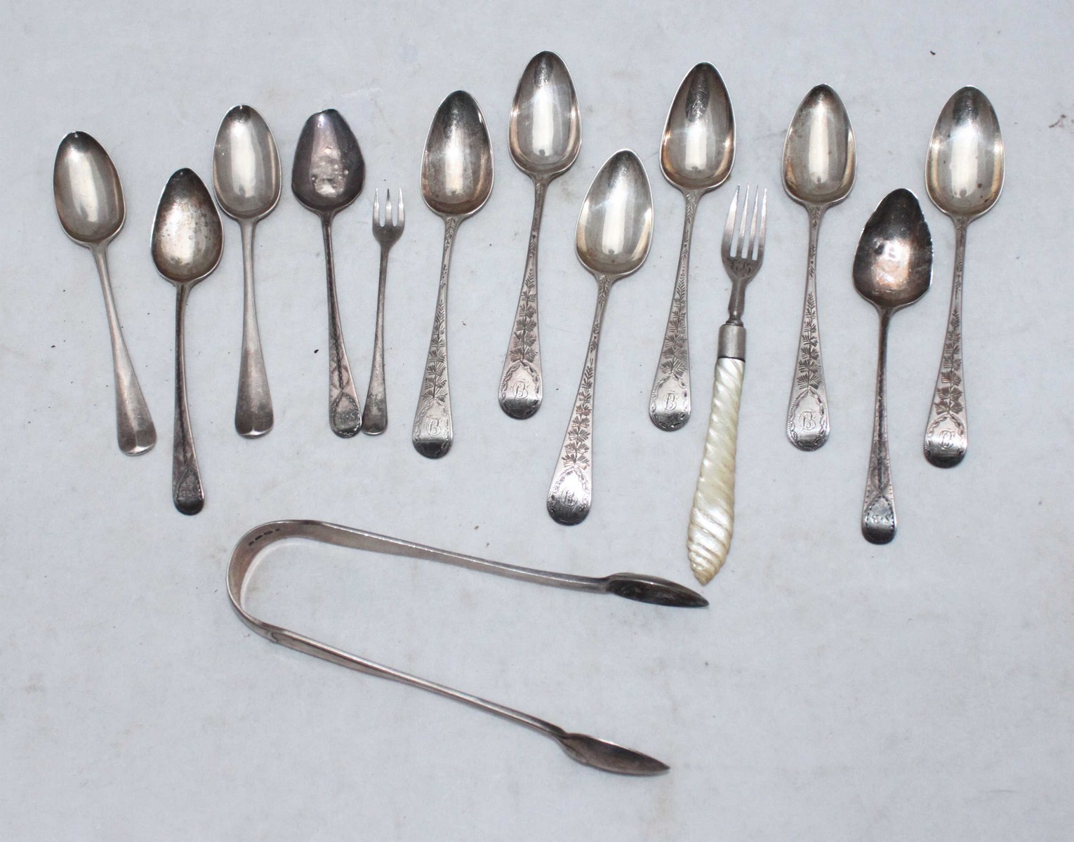 A set of six George III silver 'Old English' pattern teaspoons with bright-cut decoration, London,