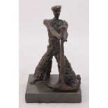 A bronze statue modelled as a stylized sailor holding up an anchor, raised on pedestal base. 21cm