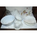 SECTION 4. Four pottery jelly moulds, a glass jelly mould and a pottery cheese dish and cover