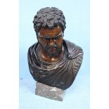 A large patinated bronze bust, possibly of the Roman Emperor Caracalla, on marble plinth,