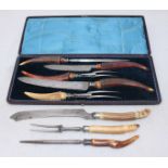 A Victorian five-piece meat carving set with antler handles and silver ferrules, Sheffield, 1866, in