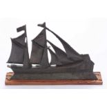 A bronze sculpture of a ship by Ian Brennan, limited edition piece number 10/18, mounted on a plinth