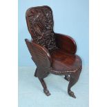 A hardwood-carved 'Swan' chair, the front support carved as a swan's neck drinking, the stylized