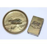 A brass ashtray and brass matchbox cover both cast with a seaplane and 'Schneider Cup Air Race