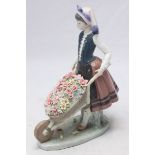 A Lladro porcelain figure 'A Barrow of Blossoms' no.1419. 26cm high.