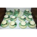 SECTION 12. A Crown Staffordshire tea set decorated with green and yellow patchwork pattern,