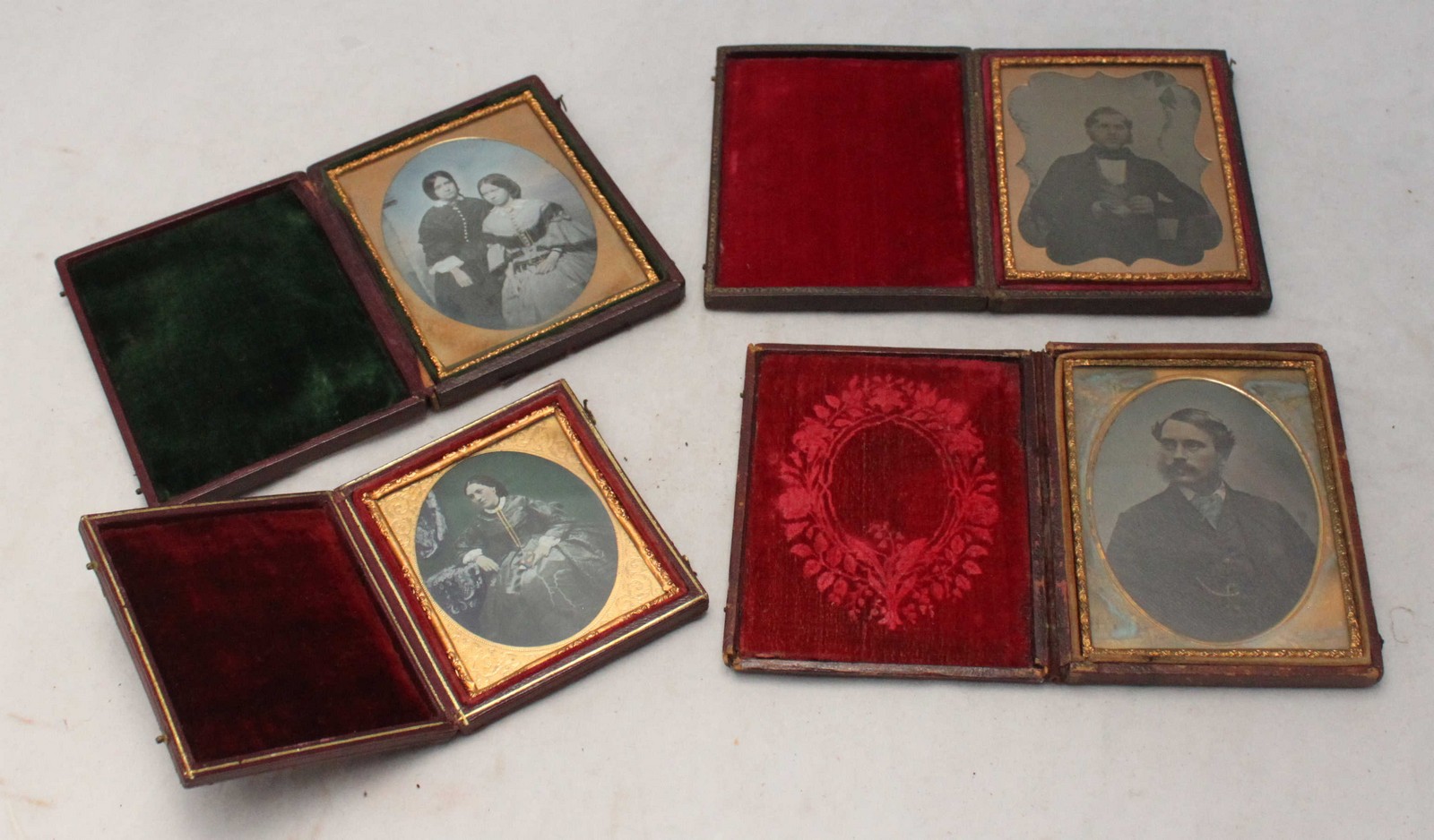 Four Victorian Dagguereotypes in gilt-metal glazed frames and original leather-covered and velvet- - Image 2 of 2