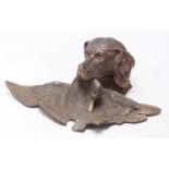 A patinated bronze inkwell modelled as a retriever carrying a duck