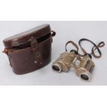 A pair of WWII tan-yellow German CAG binoculars, marked "Dienstglas 6x30 87537 H/6400", with