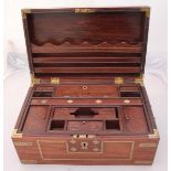 An early 20th century Anglo-Indian brass bound campaign style stationary box, the brass inlaid top