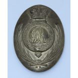A Notts Local Militia oval brass shoulder plate, with crown over garter with monogram within, and