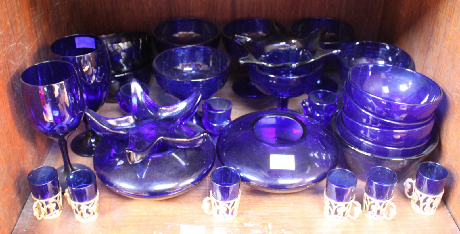 SECTIONS 41 & 42. Two shelves of blue glasswares including glasses, bowls, trinket dishes, perfume