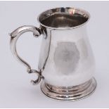 A George II silver mug by Thomas Moore II, of baluster form with plain design and scroll handle,