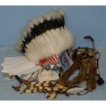 A 20th century Native American Indian Headdress with died feathers, felt skull cap and decorative