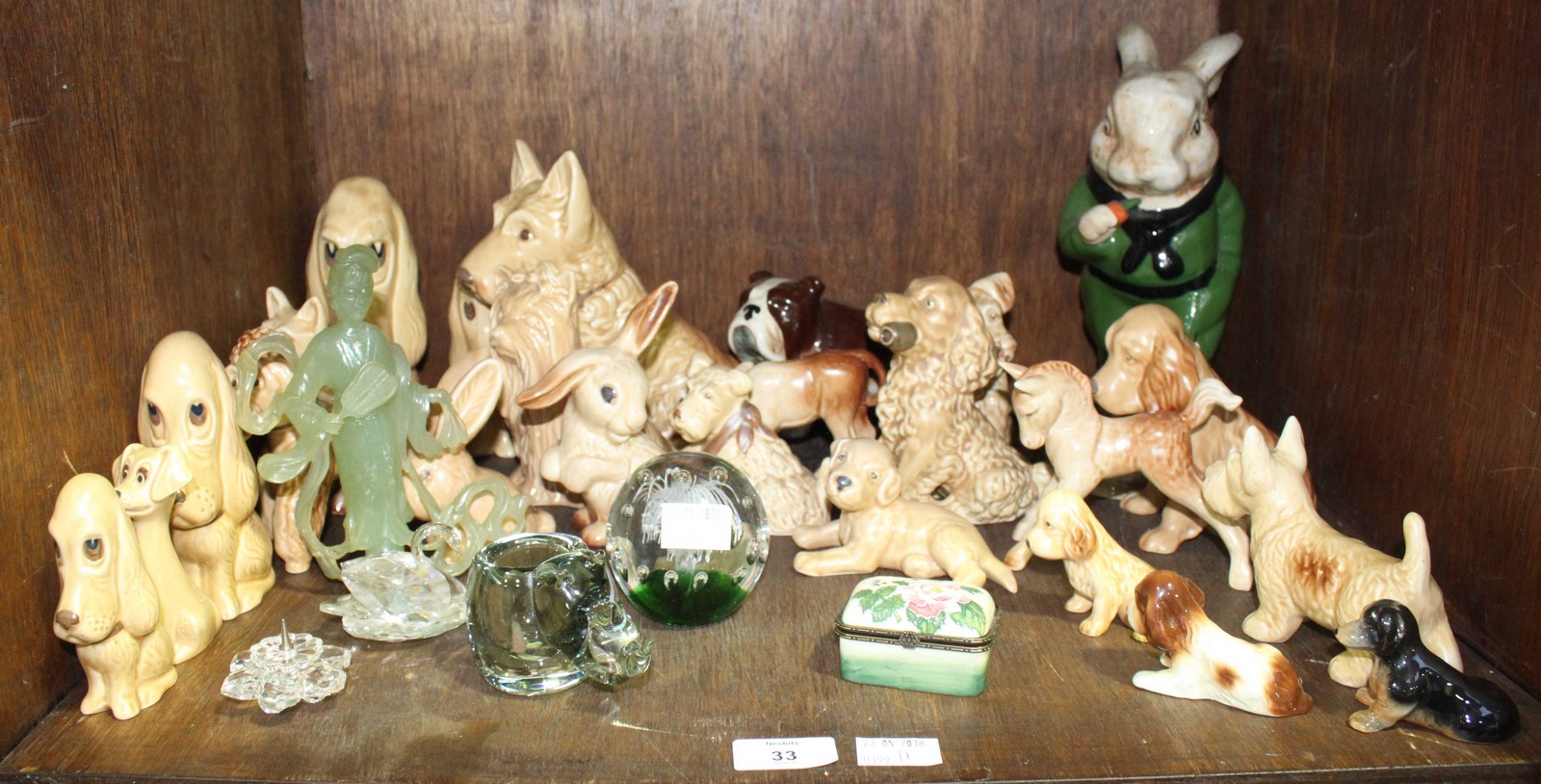 SECTION 33. A good collection of Sylvac pottery dogs and bunnies, together with a Swarovski swan and