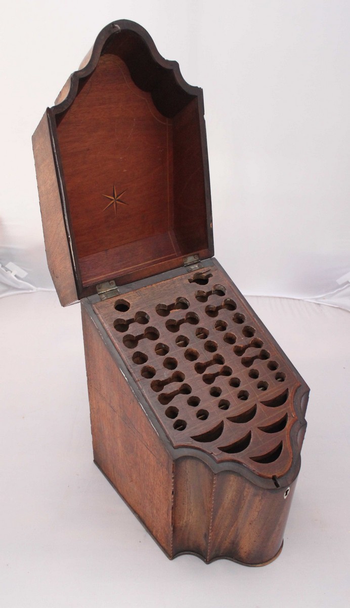 A George III inlaid mahogany knife box, with sloping cover enclosing a fitted interior for various