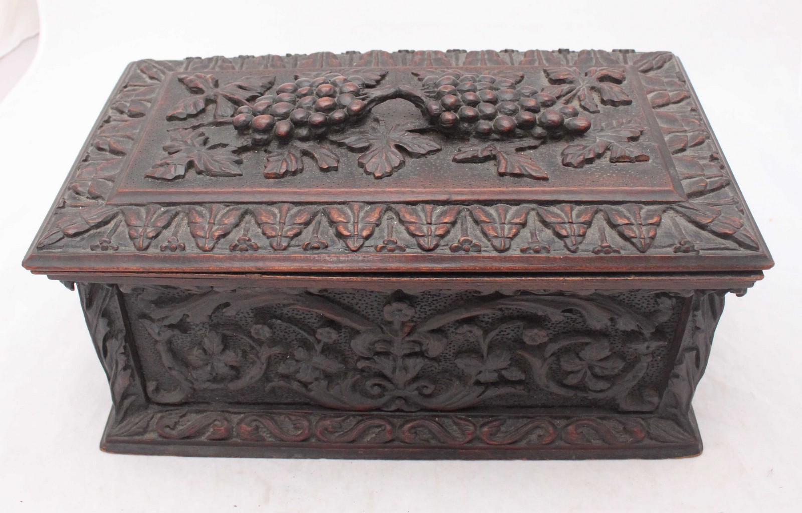 A 19th century carved and fumed oak casket of rectangular form, the whole carved with fruiting - Image 2 of 2
