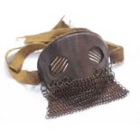 A WW1 Splatter Mask, with leather-clad metal face-plate, diagonal eye slits, hanging chain-mail