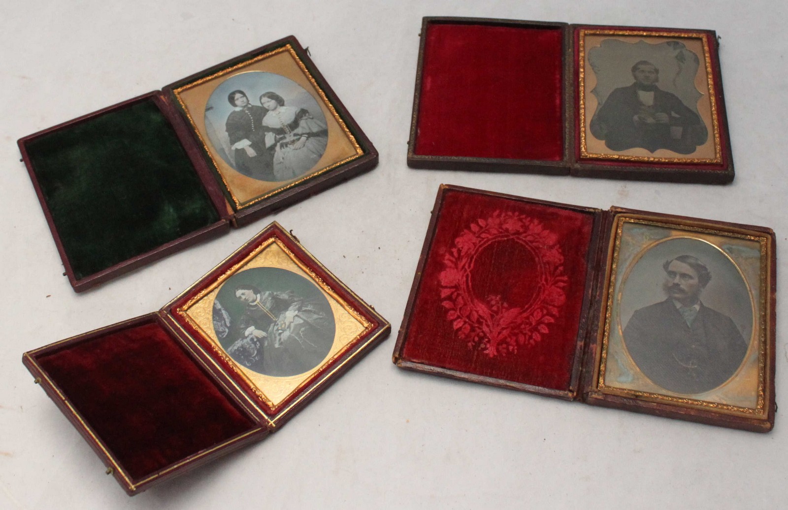 Four Victorian Dagguereotypes in gilt-metal glazed frames and original leather-covered and velvet-