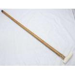 A Victorian ivory handled walking stick with 9ct gold ferrule, London 1891, maker's mark 'J.H',