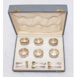 A cased set of six continental silver open salts with glass liners and silver spoons