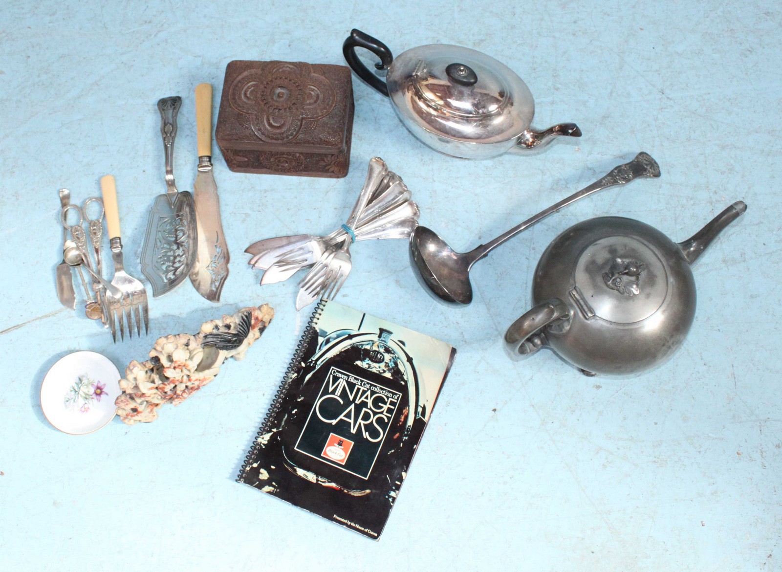 A silver-plated teapot and Britannia Metal teapot, together with a pair of ivory-handled fish