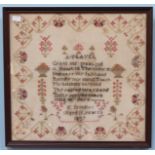 An early Victorian needlework sampler worked with verse and flowers, by E. Brookes, aged 11 years,