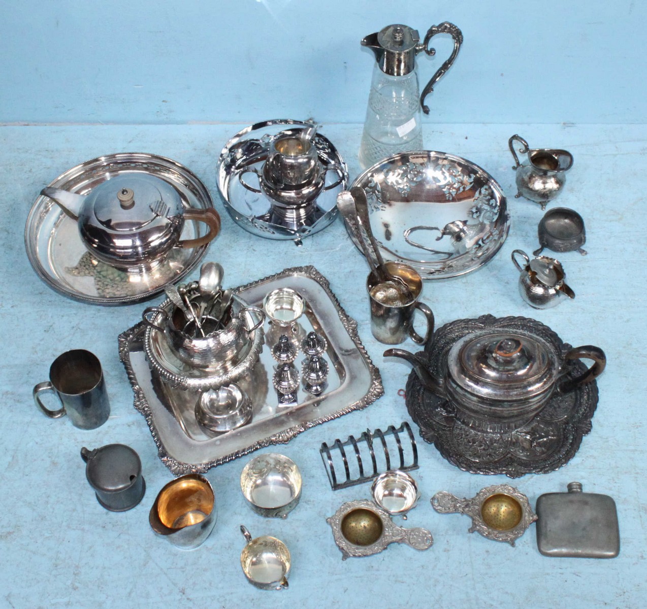 A three-piece silver-plated tea set, together with various plated bon-bon dishes, pierced