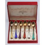 A boxed set of six guilloche enamel silver-gilt coffee spoons by David Andersen, Norway