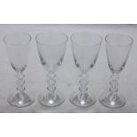 Four boxed Baccarat crystal wine glasses.