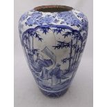 A large Chinese blue and white vase of ovoid form painted with figures reading, bamboo and trees (