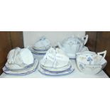 SECTION 25. A Shelley 'Blue Iris' pattern Queen Anne shape tea set, comprising teapot, sandwich