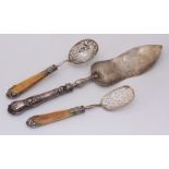 Two 19th century French silver sifting spoons, one possibly for serving boiled eggs, with silver-