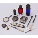 Three coloured glass perfume bottles, a silver vesta case, miniature rouge pot and hand-mirror,