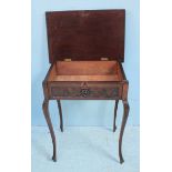 A 19th century stained and carved oak side table with hinged top enclosing storage compartment,