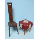 A retro footstool with red and grey Rexine upholstery, together with an ornately carved oak Welsh