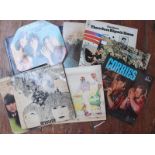 A collection of nineteen assorted vinyl records including The Beatles 'Revolver', 'Beatles for Sale'