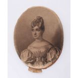 An early 19th Century half-length oval portrait of a young lady wearing her hair tied-up and satin