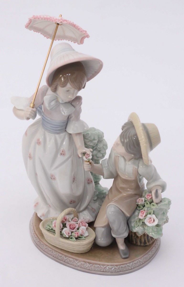 A Lladro ceramic figure-group 'For You' model number '5.453' in original box. 21cm high.