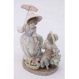 A Lladro ceramic figure-group 'For You' model number '5.453' in original box. 21cm high.