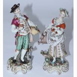 A pair of 19th century German Höchst porcelain figures depicting a man with flowers and a spade