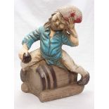 An American garden gnome on a barrel garden ornament, Henri Studio inc, approx 43cm high