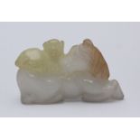 A white jade carved figure of a recumbent horse with a monkey atop its back, 7.5cm long.