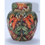 A Moorcroft pottery ginger jar and cover in the 'Flame of the Forest' pattern designed by Philip