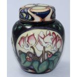 A Moorcroft pottery ginger jar and cover decorated in the 'Ashwood Gold' pattern designed by Emma