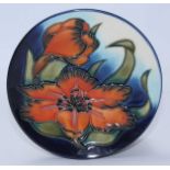 A Moorcroft pottery plate decorated with flowers in the 'Spiraxia' pattern after Emma Bossons, No.