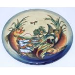 A Moorcroft pottery circular charger decorated in the 'Trout' pattern after a design by Philip