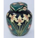 A Moorcroft Carousel Collection Ginger Jar & Cover decorated in "Daffodils' to a blue ground,