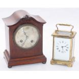 A French mahogany-cased mantel clock with silvered dial, movement striking a coiled gong, with